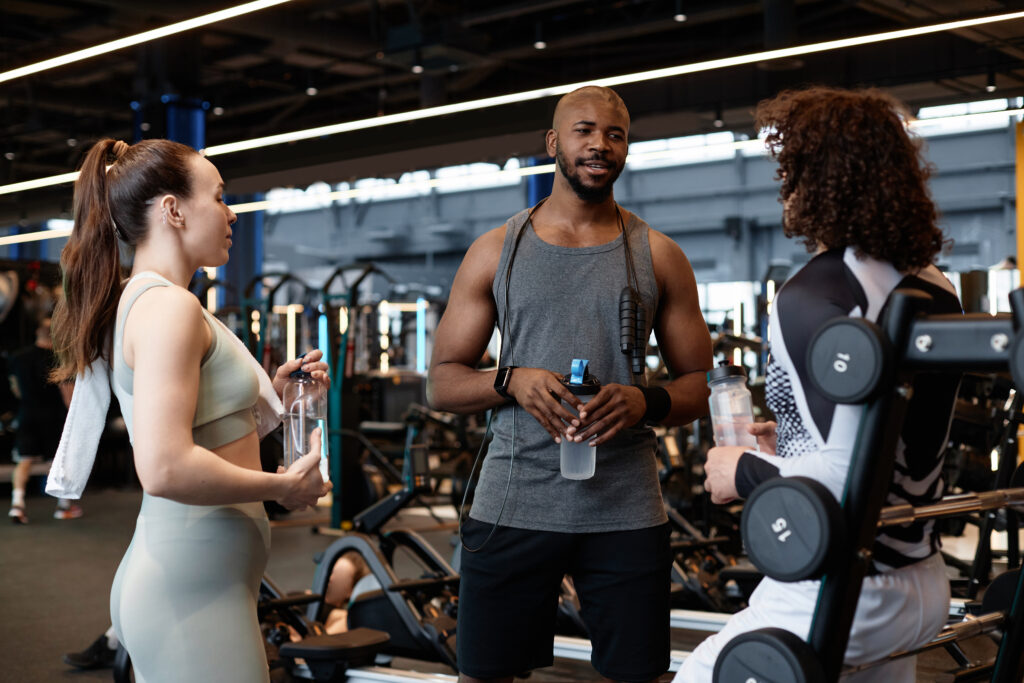 Fitness coach talking clients